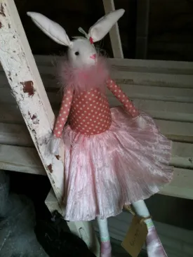 Cute rabbit toy in pink dress with silk shoes